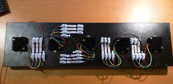 Flasher LEDs mounted on the wooden board and wired with the series resistors